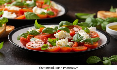 Caprese Salad With Cherry Plum Tomatoes, Mozzarella Cheese And Basil. Healthy Vegetarian Food