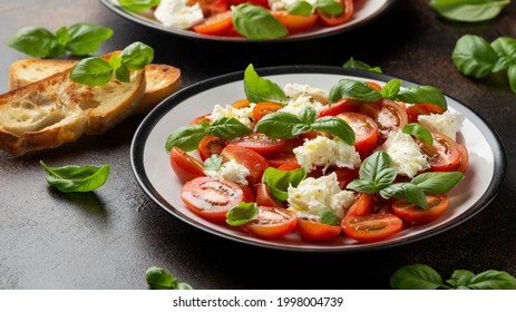 Caprese Salad With Cherry Plum Tomatoes, Mozzarella Cheese And Basil. Healthy Vegetarian Food.