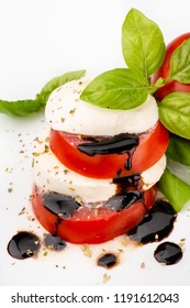 Caprese Salad With Mozzarella, Tomato, Fresh Basil Leaves And Balsamic Vinegar Glaze