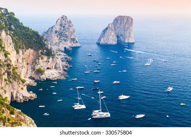 Capri Island, Italy. Mediterranean Sea Coastal Landscape With Rocks And Yachts