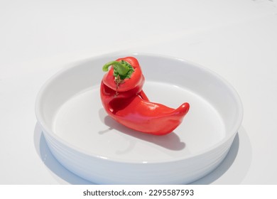 Capsicum unusually shaped isolated in white bowl.