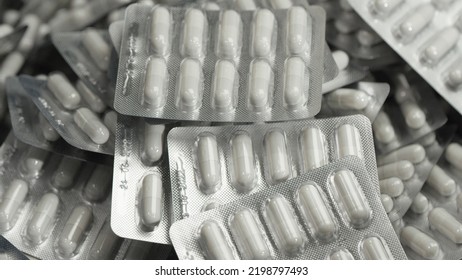 Capsule Blisters. Drug Components Medical Product Pellet Capsules. Pills With Blister Pack On White Background. Healthcare And Pharmaceutical Industry Concept. Depth Of Field