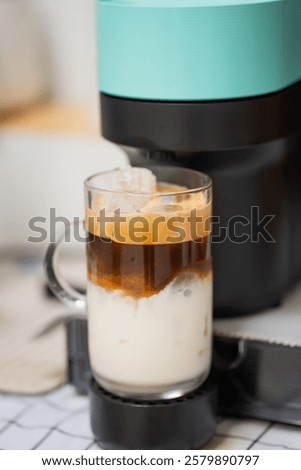 Capsule coffee machine with espresso cup. Nespresso is worldwide leader company with coffe machines and capsules.