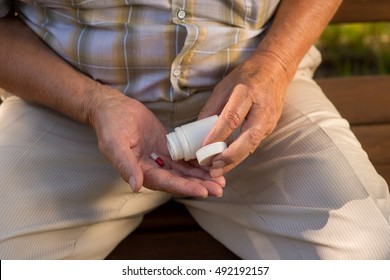 Capsule In Palm Of Hand. White Pill Bottle. Don't Increase The Dose. Use Medicine Against Pain.