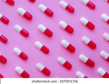 Capsule Pills Pattern On A Pink Background