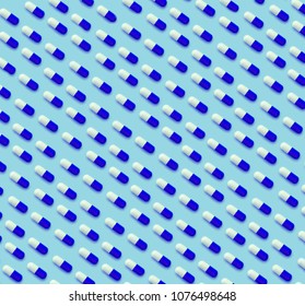 Capsule Pills Pattern Parallel On A Blue Background