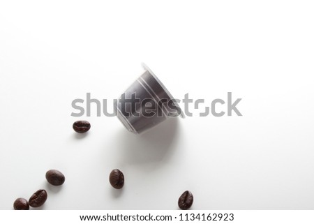 capsules of coffee on a white background