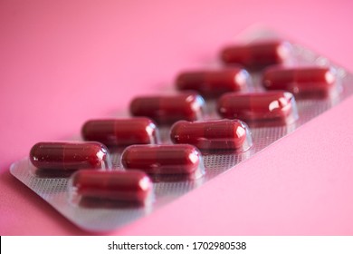 
Capsules With Medical Chemical Compound. Medicine In Red Capsule