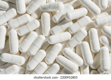 Capsules with medicine, vitamins or sports supplement close-up.
