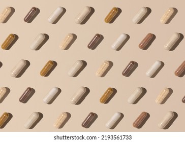 Capsules on light beige top view, hard shadows, creative pattern. Preventive medicine and healthcare, taking dietary supplements and vitamins.  Assorted pharmaceutical medicine capsules - Shutterstock ID 2193561733