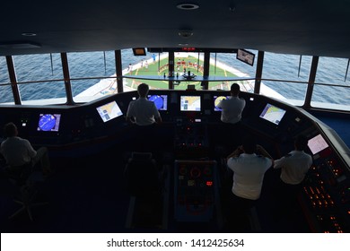 Captain And Crew In Cockpit On Cruise Ship