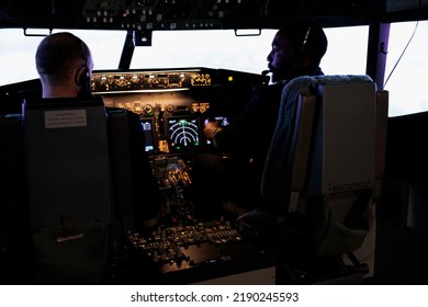 Captain And Pilot Flying Airplane With Engine Lever And Power Switch On Dashboard Command, Using Buttons On Control Panel Navigation To Fly Aircraft Jet, Professional Aviation Service.