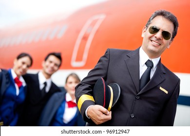 Captain Pilot With His Cabin Crew At The Airport