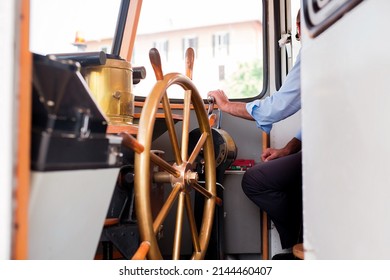 Captain's Hand On Ship Throttle Lever Close Up