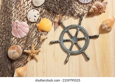 Captains Wheel With Fishing Net And Sea Shells Nautical Theme Background