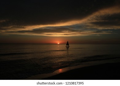 Captiva Island, Florida - 08/05/2015: Sailboat (Sunfish) At Sunset Off The Beach In Captiva Island, Florida.