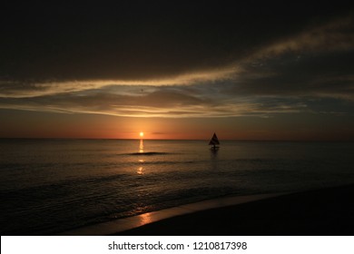 Captiva Island, Florida - 08/05/2015: Sailboat (Sunfish) At Sunset Off The Beach In Captiva Island, Florida.