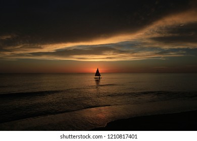 Captiva Island, Florida - 08/05/2015: Sailboat (Sunfish) At Sunset Off The Beach In Captiva Island, Florida.