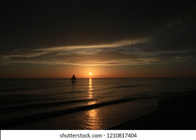 Captiva Island, Florida - 08/05/2015: Sailboat (Sunfish) At Sunset Off The Beach In Captiva Island, Florida.