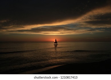 Captiva Island, Florida - 08/05/2015: Sailboat (Sunfish) At Sunset Off The Beach In Captiva Island, Florida.