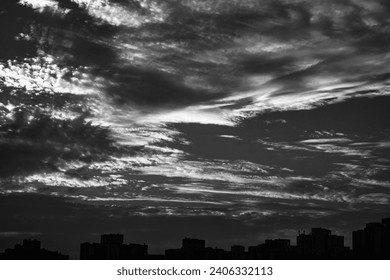 Captivating aerial view of dramatic black n white cloud formations, showcasing mesmerizing styles, shapes, and textures. Fit for visuals Storytelling.