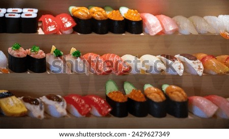 A captivating display of artificial sushi, skillfully rendered as sampuru, beckons diners to savor the visual feast before embarking on a culinary journey of authentic Japanese flavors