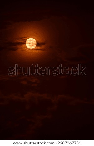 Captivating evening sky with red moon and clouds, creating a mesmerizing nocturnal scene. ストックフォト © 