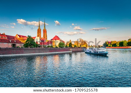 Captivating evening view of Tumski island with St. John  church. Splendid spring scene of Odra river. Colorful cityscape of Wroclaw, Poland, Europe. Traveling concept background.