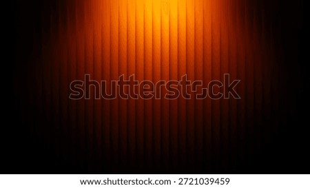 A captivating image featuring vibrant orange light casting a warm glow on vertical lines, creating a gradient effect with a sense of depth and warmth.