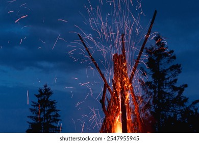 Captivating image of a massive conical bonfire during the Ivan Kupala celebration in the Carpathian mountains, illuminating the night sky