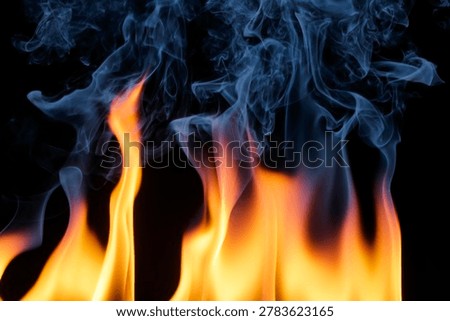 Captivating image showcasing dynamic flames and wispy smoke, creating a stunning visual contrast of orange and blue, perfect for artwork or thematic designs.