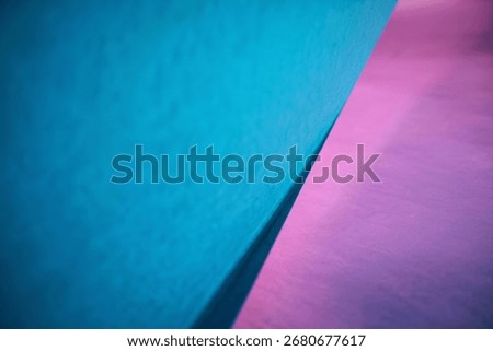 A captivating image showcasing the intersection of teal and mauve geometric shapes