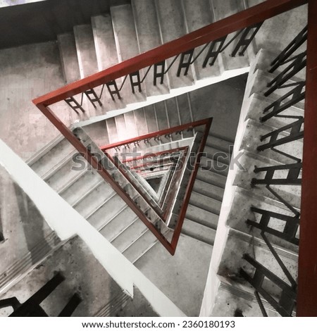 Captivating inside view of a triangle-shaped lighthouse staircase. A mesmerizing architectural perspective that combines form and function seamlessly. 