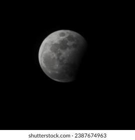 Captivating lunar eclipse image showcasing the celestial ballet as Earth's shadow gracefully envelops the moon
