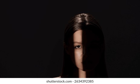Captivating Portrait with Dramatic Shadow Play and Light Beam