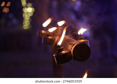 A captivating scene featuring elegant flames from lanterns, creating a warm and enchanting ambiance for outdoor gatherings or celebrations at night.
