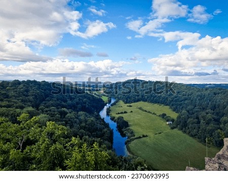 A captivating scene from the picturesque Wye Valley, where lush landscapes and winding waters create a mesmerizing view.The Wye Valley is designated an Area of Outstanding Natural Beauty.
