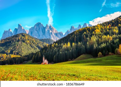 Captivating scenery in Dolomites with the St. John's in Ranui Chapel.  Location: Santa Maddalena village, Val di Funes, Trentino-Alto Adige, Dolomites, Italy, Europe