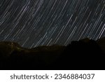 Captivating Star Trail Photography: Mesmerizing celestial trails painted across the night sky. Long exposure astrophotography capturing the beauty of constellations, galaxies, and the cosmos. Serene n