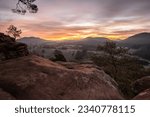 Captivating Sunrise at Wachtfelsen, Wernersberg. Enchanting Pfälzerwald: Mist, clouds, and a fir tree in the morning glow