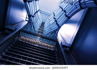 A captivating view of network cables running through a data center, showcasing modern technology and structured organization for optimal performance and connectivity.