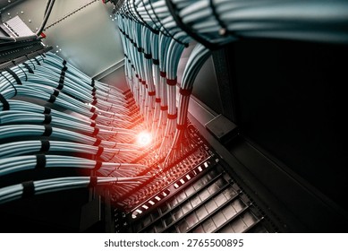 A captivating view of a network of data cables within a server setup, emphasizing modern technology and organized infrastructure for data management.