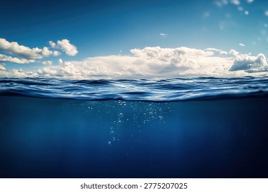 A captivating view of the ocean, split between the underwater world and the sky above, showcasing the beauty of both realms.
