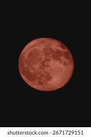 A captivating view of a red moon, a celestial spectacle during a lunar eclipse, set against the dark night sky.
