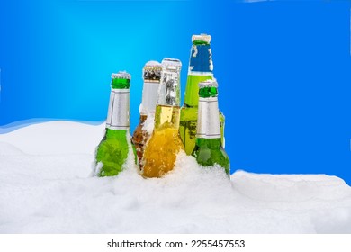 Capture the refreshing winter vibe with this high-quality close-up image of beer bottles in fresh snow. Perfect to add a touch of coolness to your project, get this image now to your collection.
