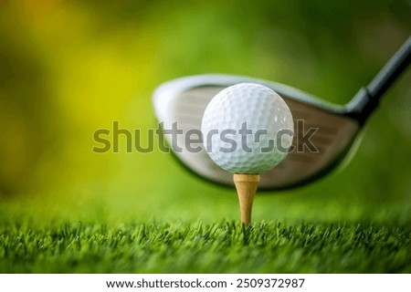 Capture the thrill of golf with this high-resolution image showcasing a golfer in mid-swing on a lush green fairway. The golfer, dressed in modern athletic wear, demonstrates perfect form as they stri