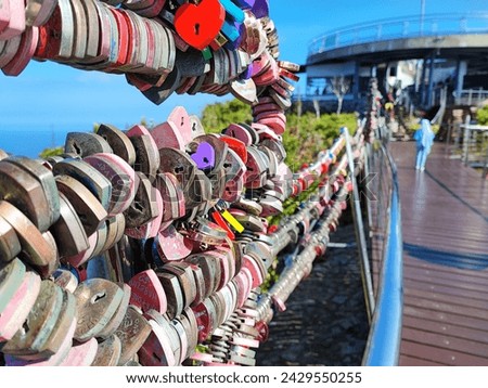 Capture the timeless tradition of love locks symbolizing eternal love and commitment. A romantic gesture adorning bridges worldwide.