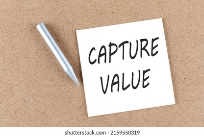 CAPTURE VALUE Text On A Sticky Note On Cork Board With Pencil ,