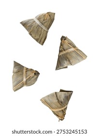 Captured in a dynamic, eye-catching composition, four individual Zongzi parcels are artfully suspended mid-air against a stark white background. Each Zongzi, a traditional Chinese delicacy of glutinous rice wrapped in bamboo leaves, is tied with string, showcasing its characteristic triangular shape and textured wrapping. This unique presentation makes the image ideal for food-related websites, culinary blogs, advertising campaigns for Asian restaurants, or articles discussing food culture and traditions.