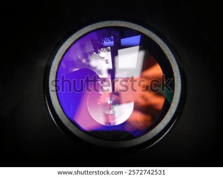 Capturing abstract colored shapes through the lens, enhanced by the play of diffracted light.